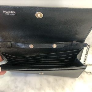 PRADA Saffiano Lock Leather wallet on chain.